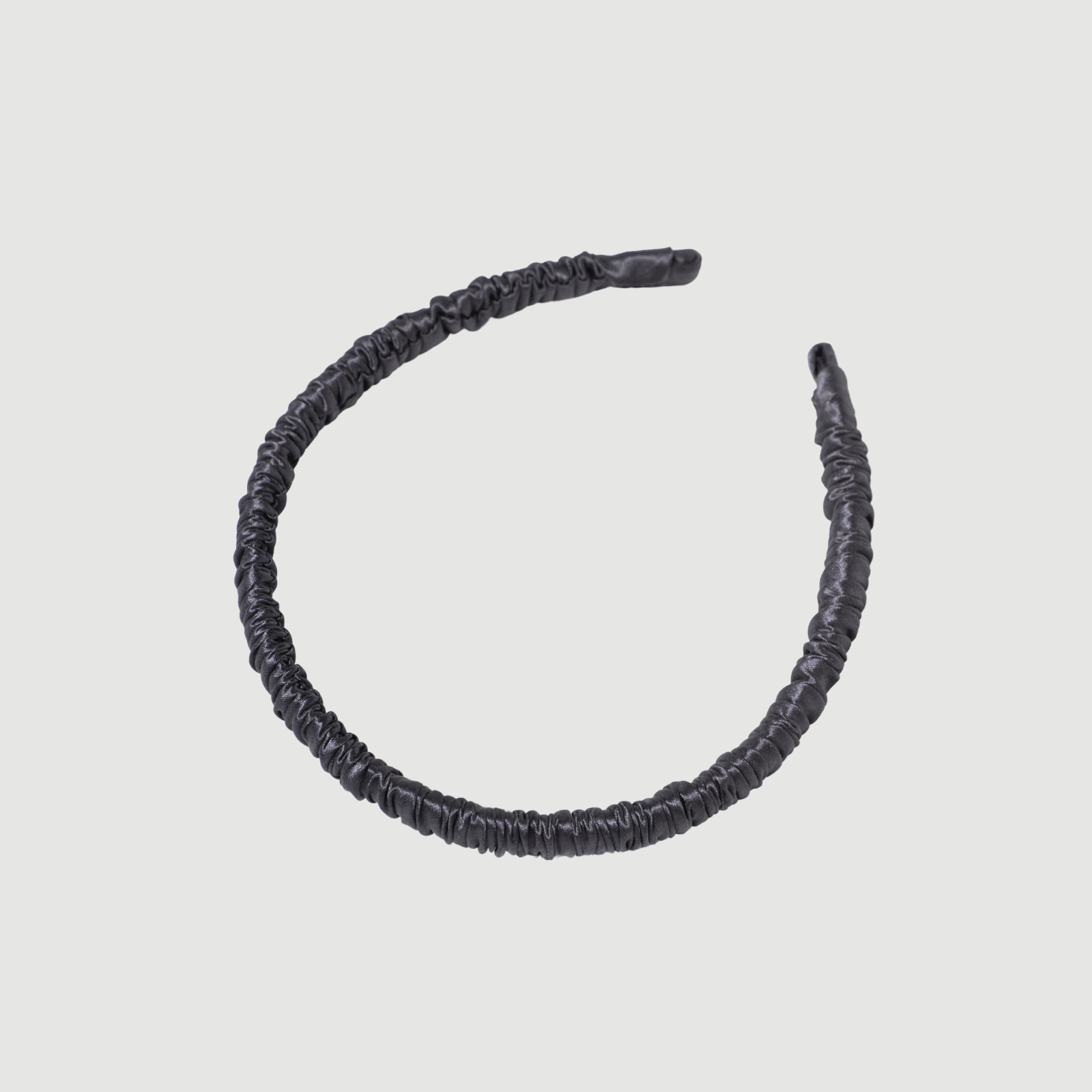 premium silk thin headband on a plain background